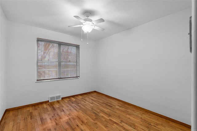 unfurnished room with ceiling fan and light hardwood / wood-style flooring