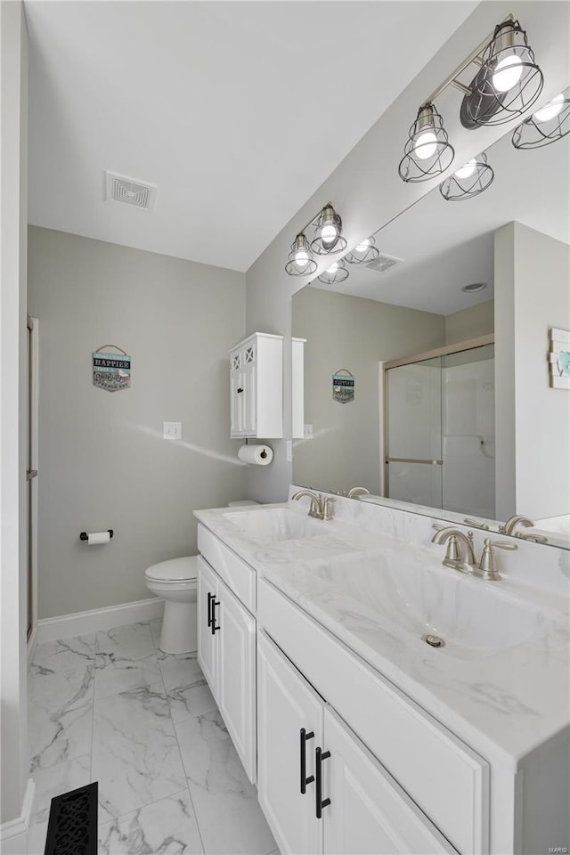 bathroom featuring marble finish floor, visible vents, a sink, and baseboards