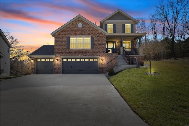 traditional-style home with driveway, a garage, brick siding, a porch, and a front yard