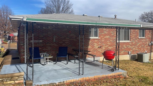 rear view of house with a patio area and central air condition unit