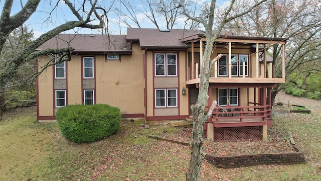 back of property featuring a wooden deck