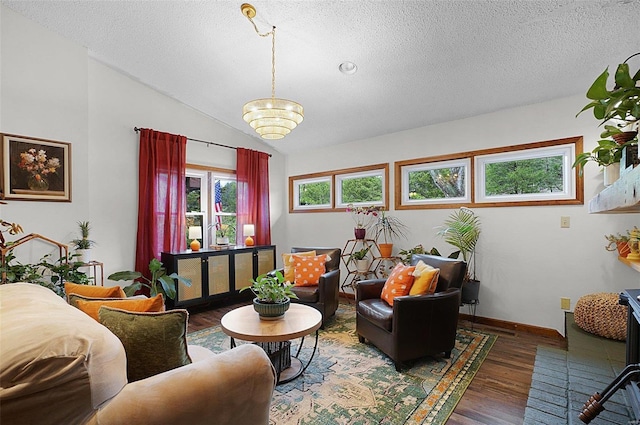 living room featuring a textured ceiling, vaulted ceiling, and dark wood-type flooring