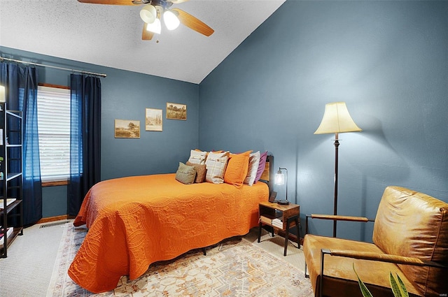 bedroom with light carpet, vaulted ceiling, and ceiling fan