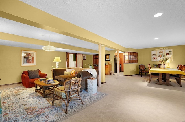 living room with a textured ceiling and light colored carpet