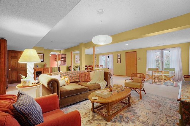 carpeted living room featuring a textured ceiling