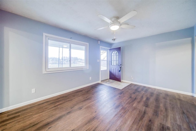 spare room with ceiling fan and wood-type flooring