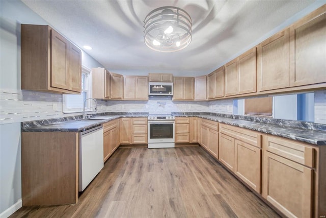 kitchen with dishwasher, light brown cabinets, sink, white range with electric stovetop, and wood-type flooring