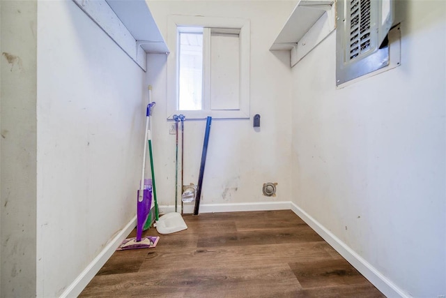 laundry room with dark wood-type flooring