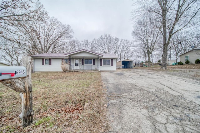 single story home with a porch