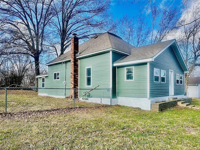 view of home's exterior with a yard