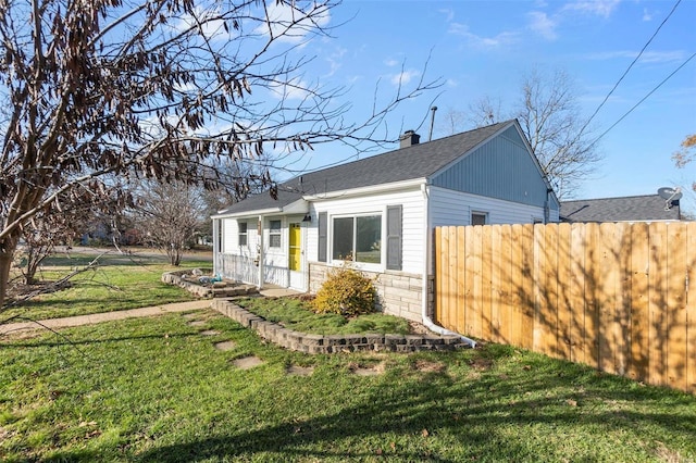 view of home's exterior with a lawn