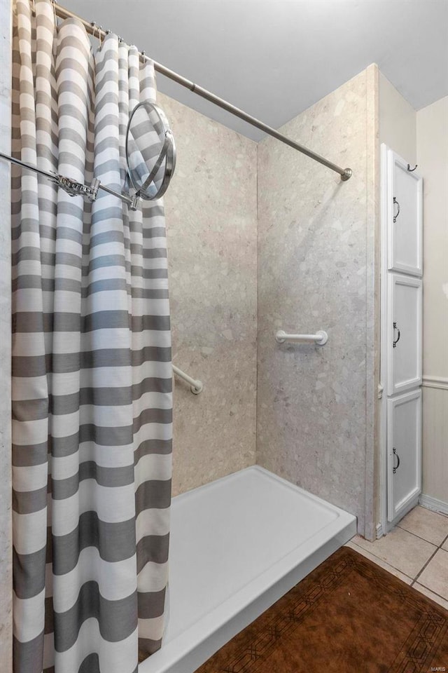 bathroom with tile patterned floors