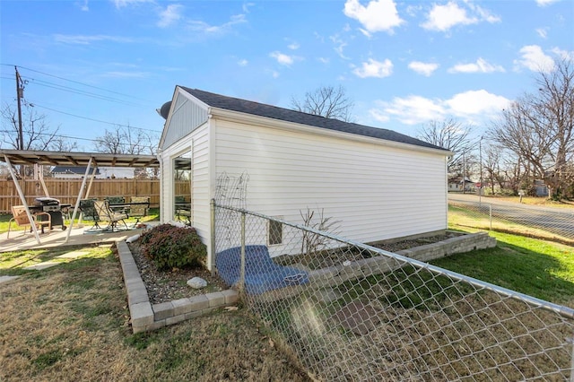 view of side of property featuring a patio area