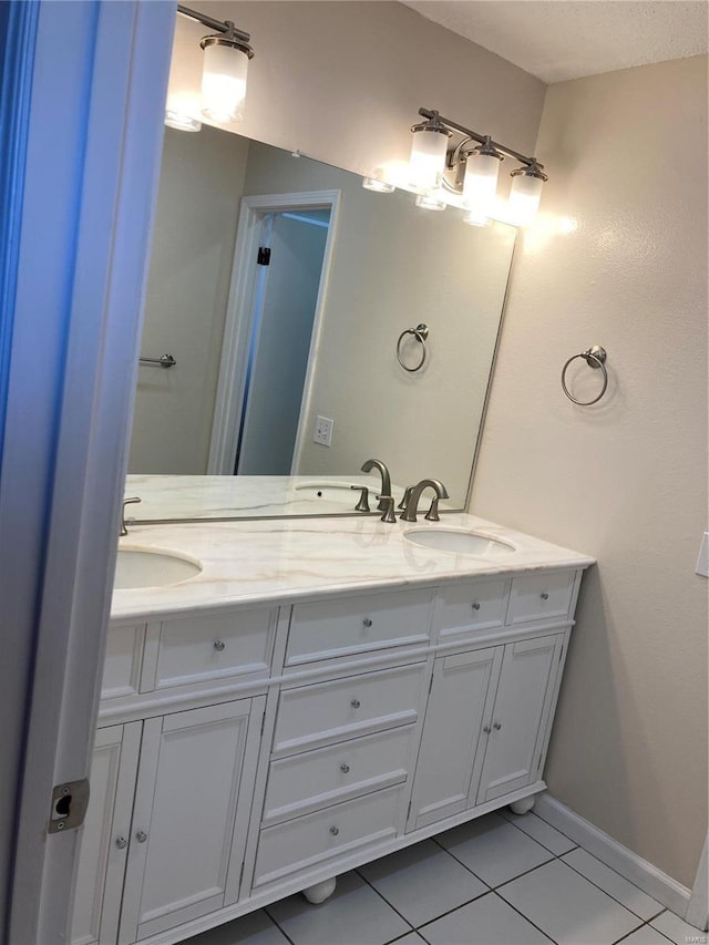 bathroom featuring tile patterned floors and vanity