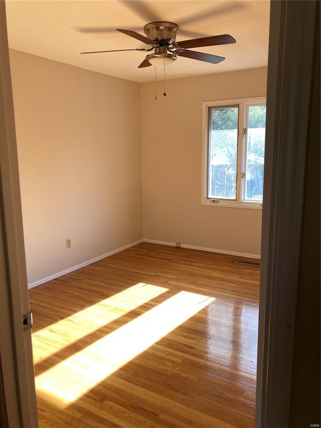 unfurnished room with light hardwood / wood-style floors and ceiling fan