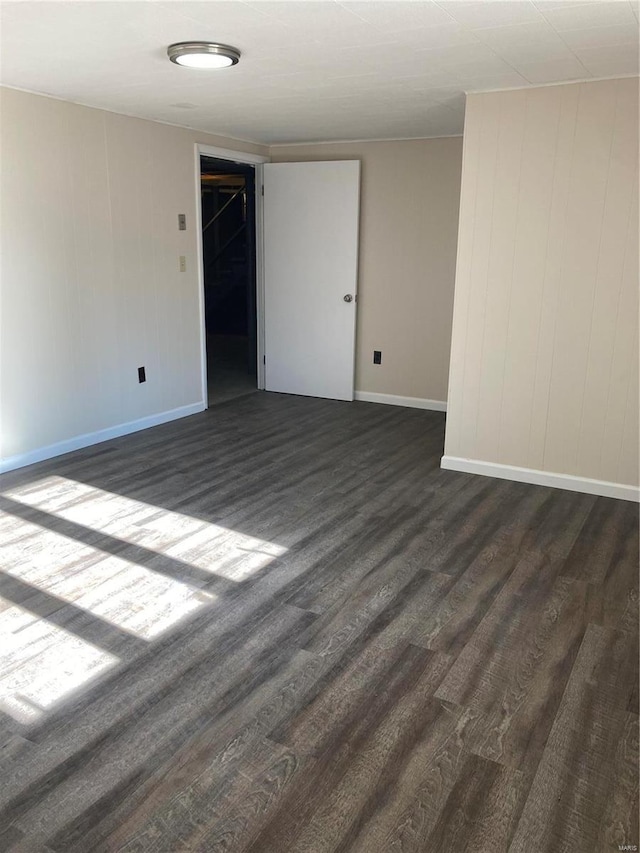 spare room featuring dark hardwood / wood-style flooring