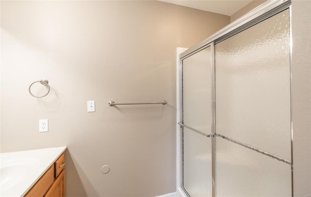 bathroom with vanity and walk in shower