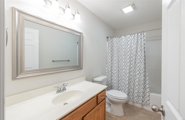 full bathroom with tile patterned floors, vanity, toilet, and shower / bathtub combination with curtain