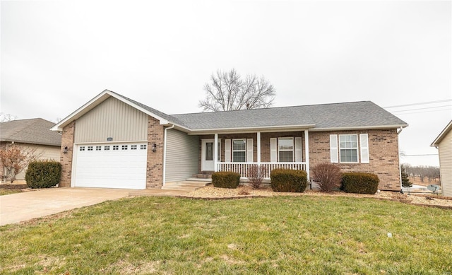 ranch-style house with covered porch, a garage, and a front yard