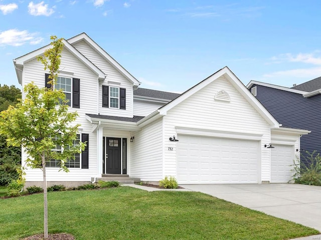 front of property featuring a garage and a front lawn