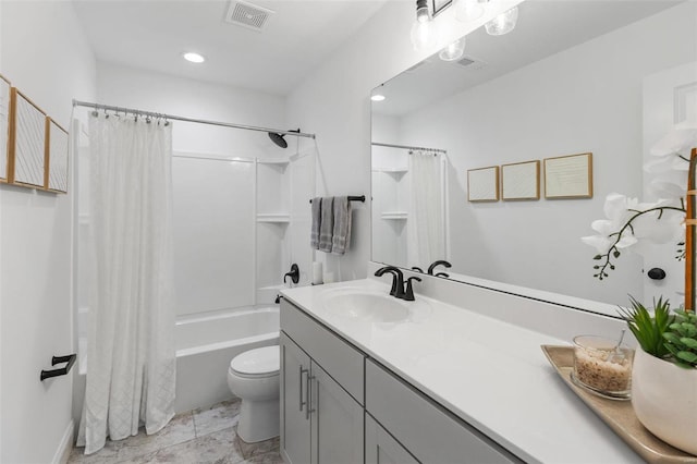 full bathroom featuring vanity, shower / bath combination with curtain, and toilet