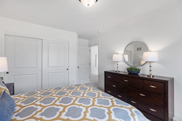 carpeted bedroom with a closet