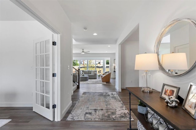 corridor with dark hardwood / wood-style floors