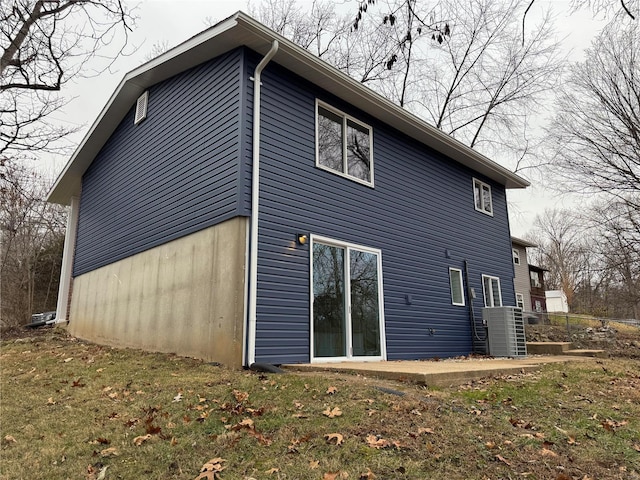 view of side of property with a yard