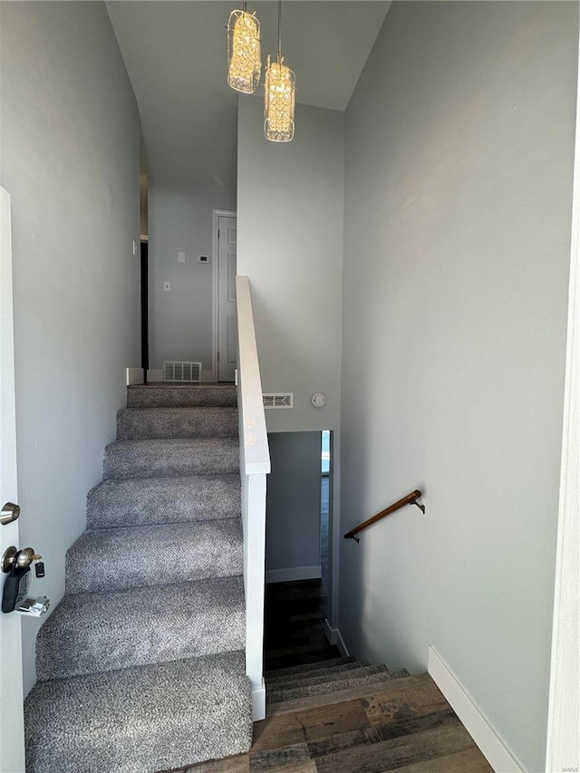 stairway featuring hardwood / wood-style flooring