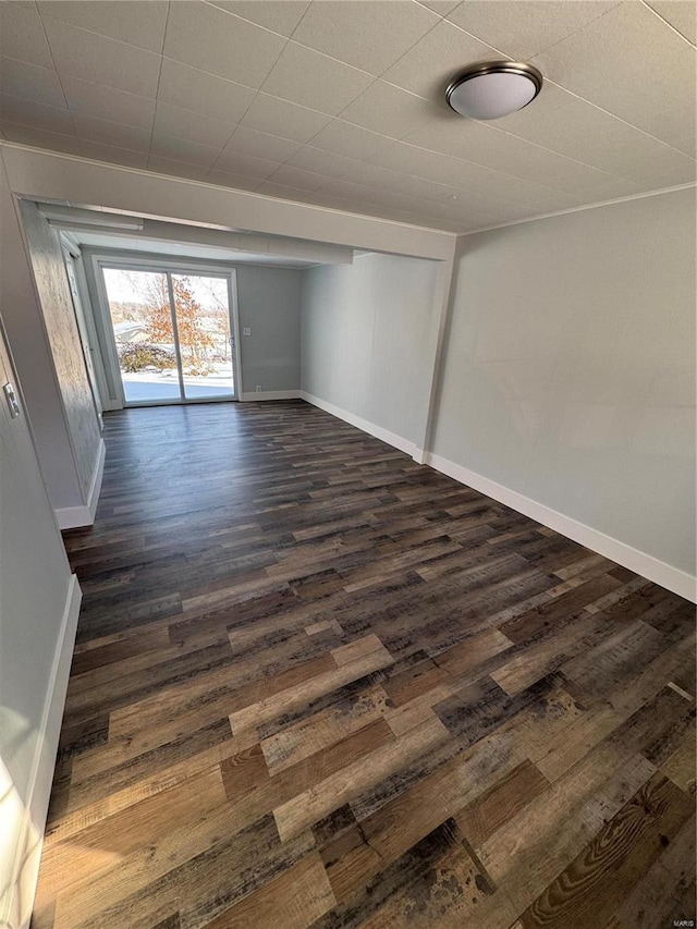 empty room with dark hardwood / wood-style floors