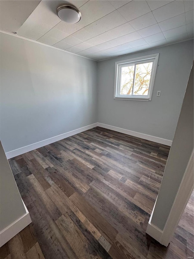 spare room featuring dark hardwood / wood-style flooring