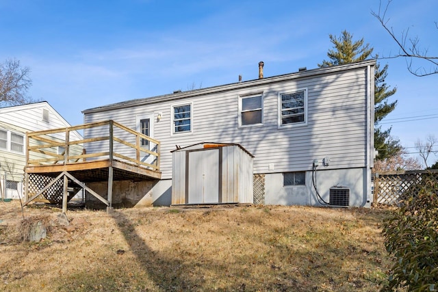 rear view of property featuring central AC unit and a deck