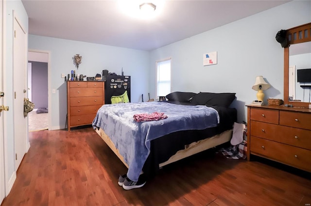 bedroom featuring dark hardwood / wood-style floors