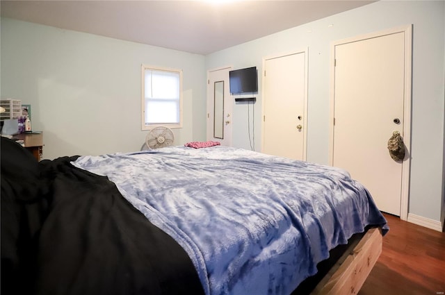 bedroom featuring dark wood-type flooring