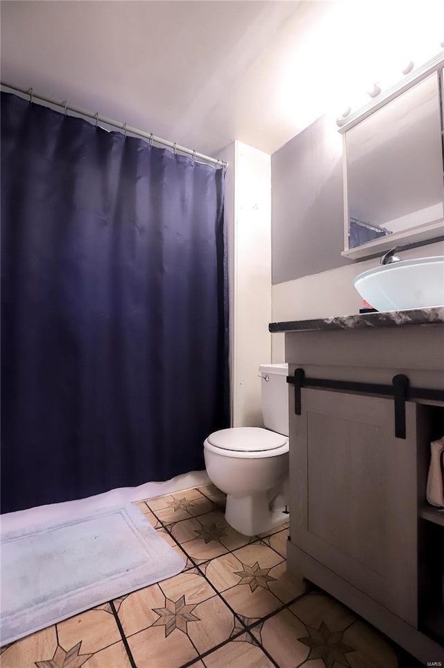 bathroom with tile patterned flooring and vanity