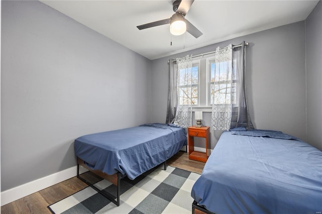 bedroom featuring ceiling fan and wood-type flooring