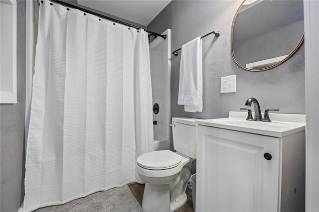 full bathroom with shower / bath combo, vanity, and toilet