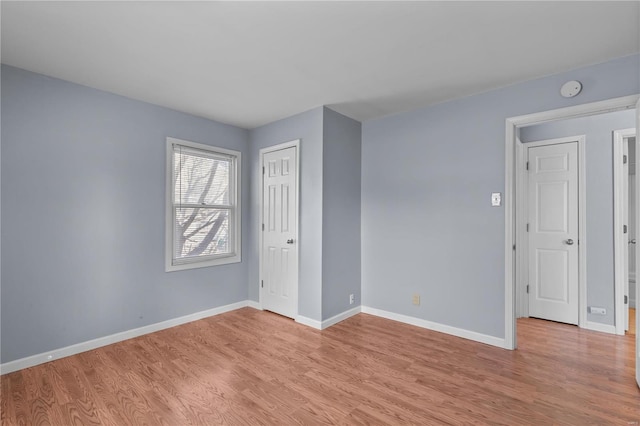 unfurnished room featuring light wood-type flooring