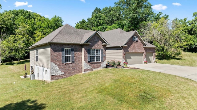 view of front of property featuring a garage, driveway, a front lawn, and brick siding