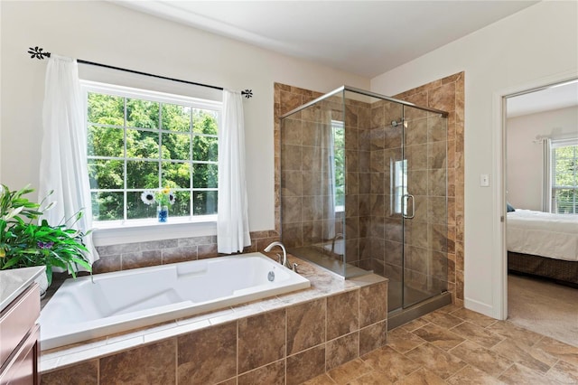 ensuite bathroom with a stall shower, a bath, and ensuite bathroom