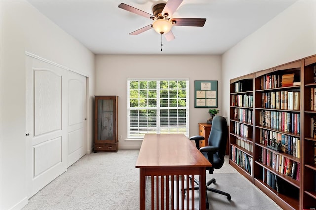 office area featuring carpet flooring and a ceiling fan