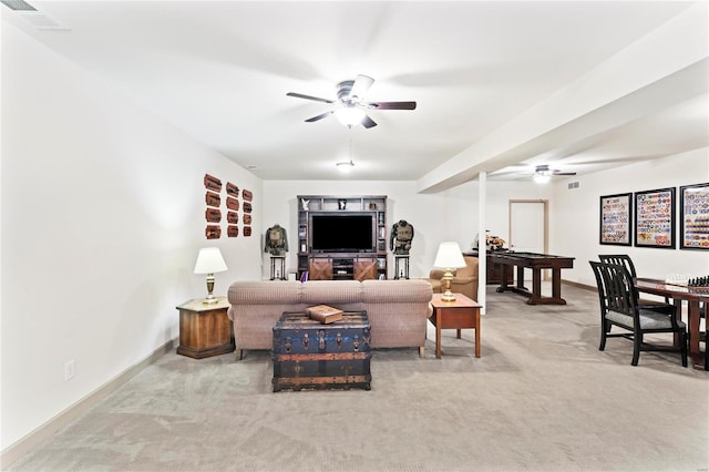 living room featuring baseboards, carpet flooring, visible vents, and a ceiling fan