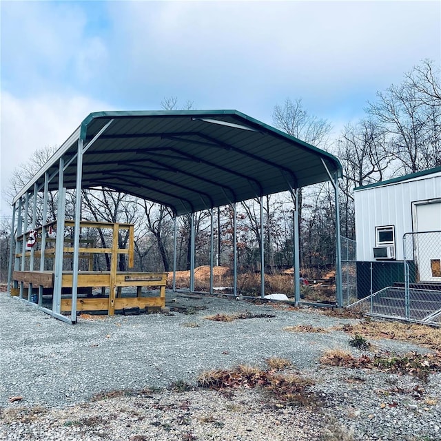 view of vehicle parking featuring a carport