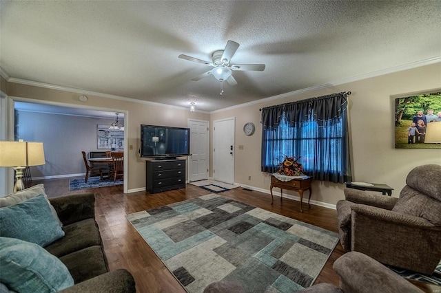 living room with ceiling fan, dark hardwood / wood-style flooring, crown molding, and a textured ceiling