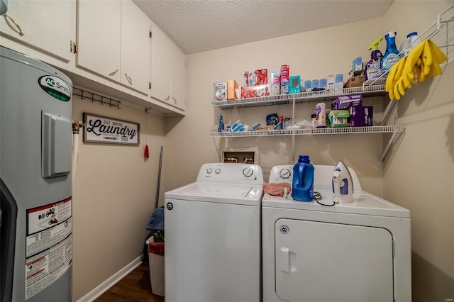 laundry room featuring cabinets, a textured ceiling, water heater, separate washer and dryer, and dark hardwood / wood-style floors