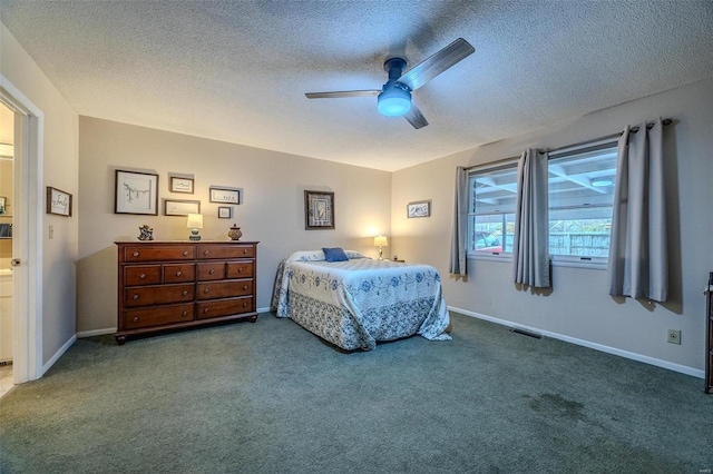 bedroom featuring carpet flooring, ceiling fan, and a textured ceiling