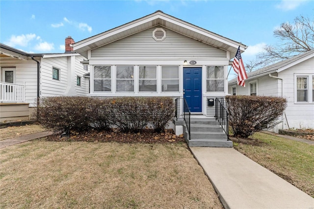 view of front of home with a front yard