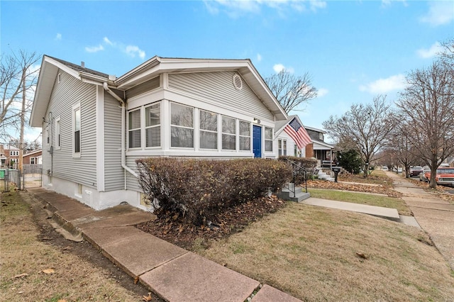 view of home's exterior featuring a lawn