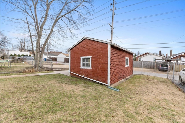 view of outbuilding featuring a lawn