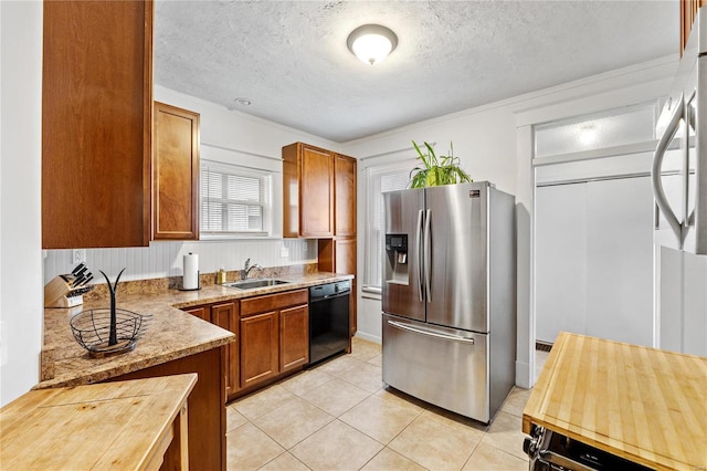 kitchen featuring dishwasher, sink, stainless steel fridge with ice dispenser, a textured ceiling, and light tile patterned floors